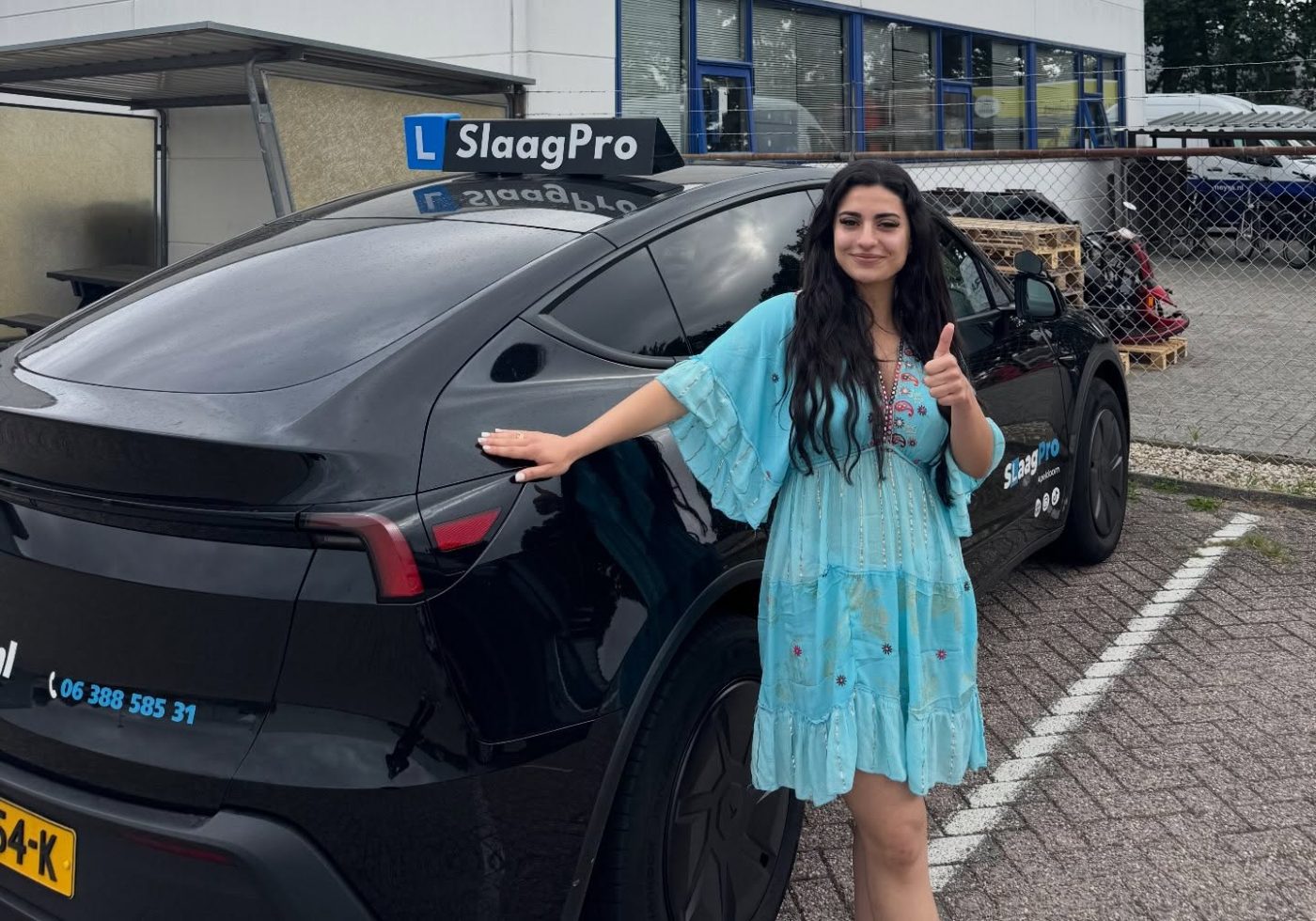 SlaagPro student with the Tesla lesson car